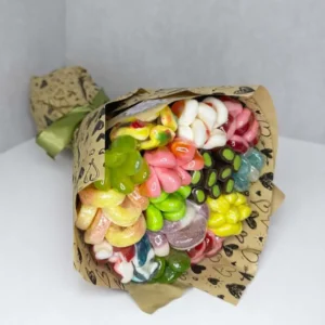 Jelly candy bouquet Looking for fun and unique edible gifts? This vibrant bouquet replaces traditional flowers with a mouth-watering assortment of colorful gummy and jelly candies. Wrapped in trendy kraft paper with heart prints and tied with an olive-green ribbon, it's the ultimate sweet surprise for birthdays, kids, or anyone who loves a sugary treat.