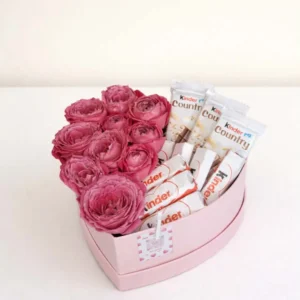 Luxury pink heart gift box arranged with fresh peony-shaped spray roses and genuine Kinder chocolate bars by BooqArt flower shop