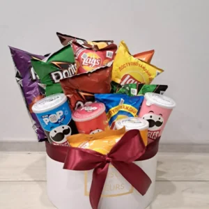 Premium white gift box with maroon ribbon and a wide assortment of chips from various brands` Pringles, Doritos, Lay's