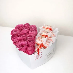 Luxury white heart-shaped gift box filled with fresh magenta peony roses and Raffaello chocolates by BooqArt